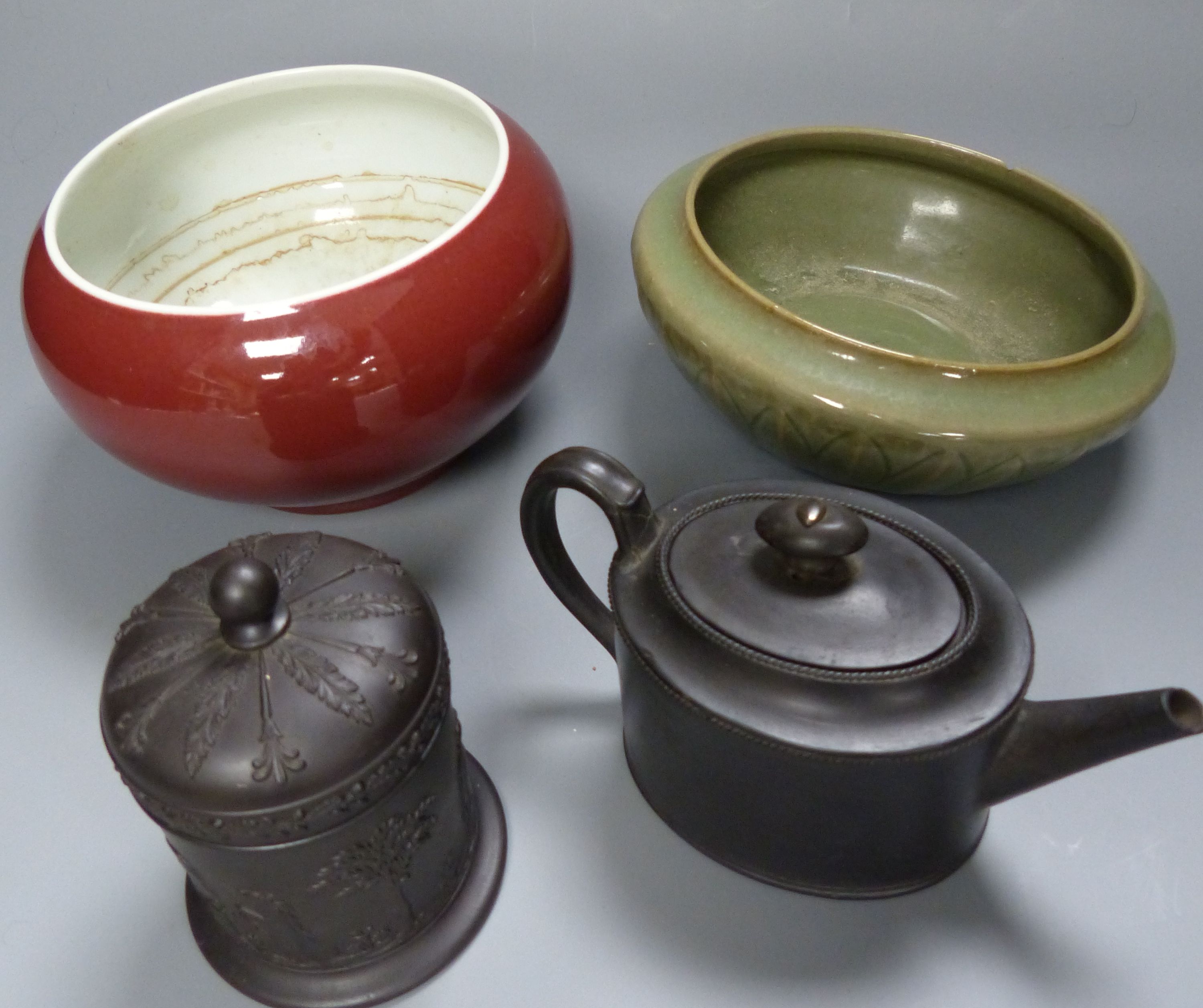 A Chinese Sang de Boeuf censer, a similar celadon glazed bowl, together with a Wedgwood black basalt teapot, c.1800 and a similar 20th